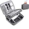 Grey waterproof electronics organiser with double-layer interior, adjustable dividers, and carrying handle