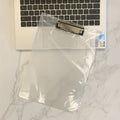 Transparent A4 clipboard with metal clip holding white paper, available in blue, green, red, and white.