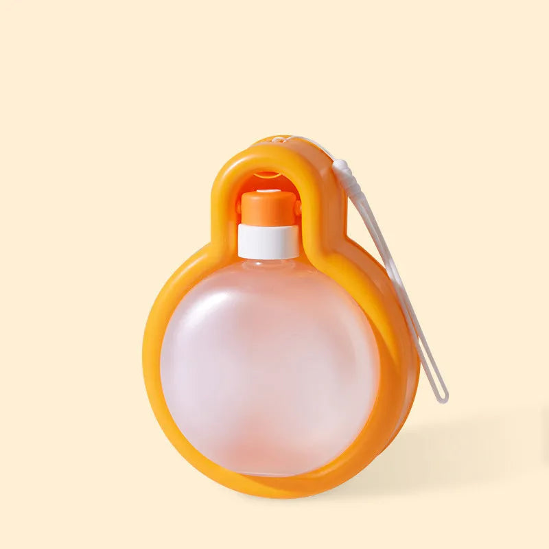 Green portable dog water bottle with pull-out drinking bowl for outdoor travel and camping.