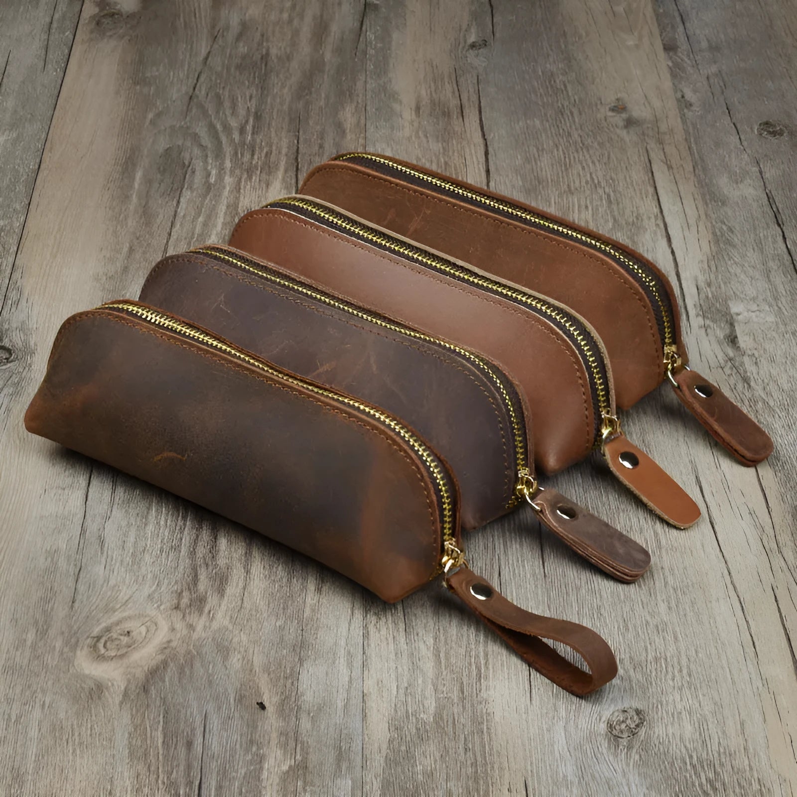 Square cowhide leather pencil case with zip closure measuring 18cm