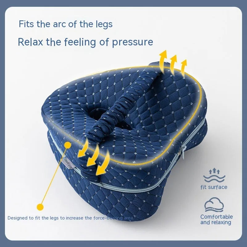 Love heart-shaped dark blue memory foam leg pillow for adult knee and leg support.
