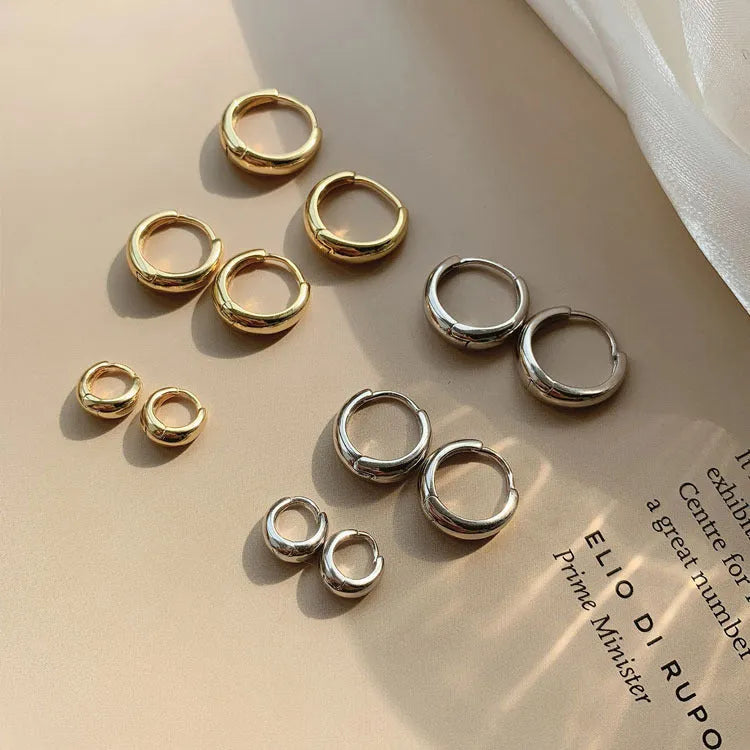 Women's gold and silver water drop earrings in geometric minimalist design with three size options