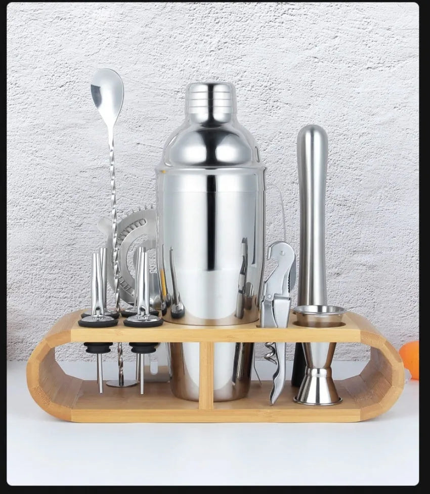 23-piece stainless steel cocktail set with shakers and bar tools on counter
