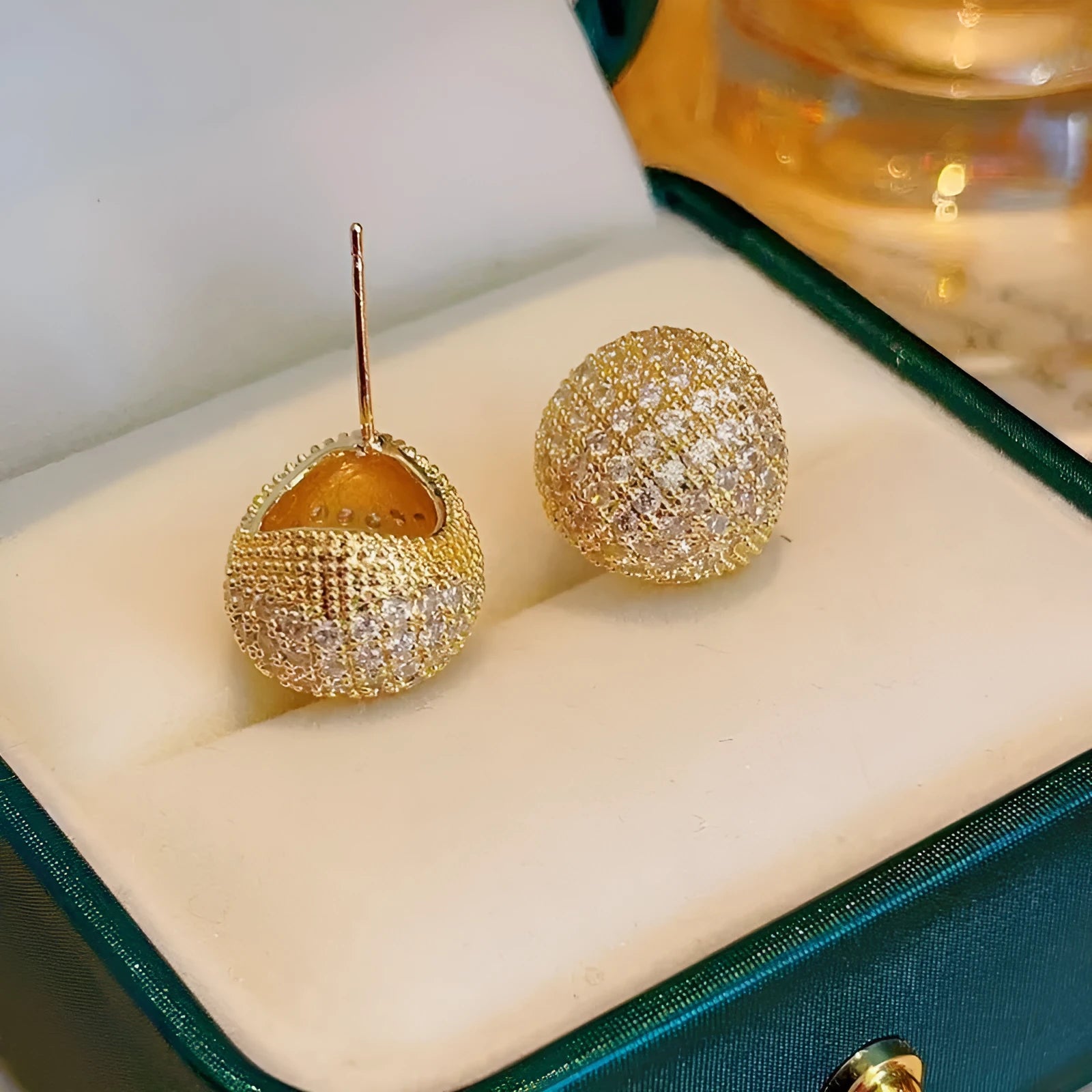 Gold and white geometric drop earrings with diamond-effect golden beans ear clips and sphere details
