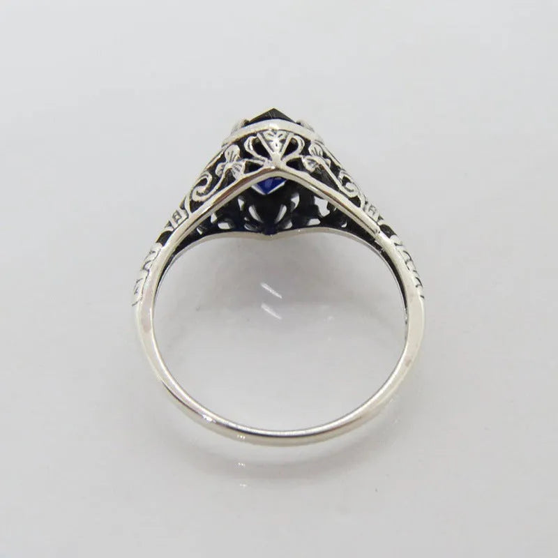 Women's geometric hollow ring in silver electroplated alloy showing openwork pattern