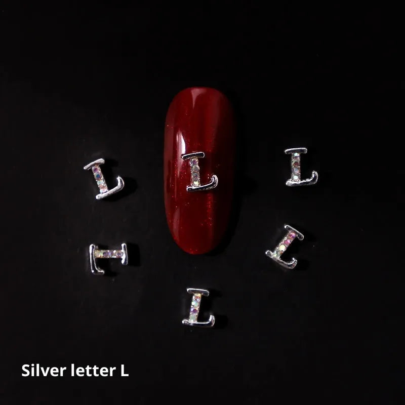 Gold alloy letter A nail ornament charm with crystal detail on a square chain base