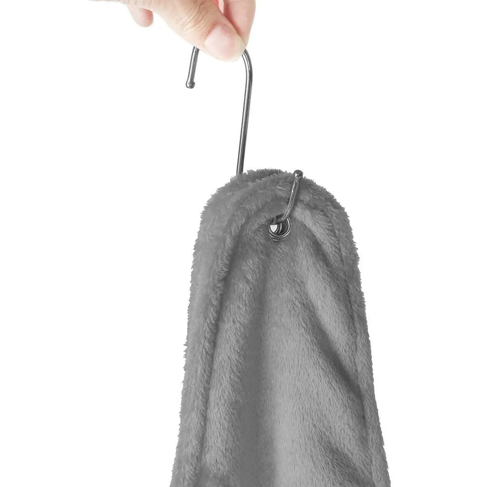 Pet grooming hammock harness in pink with double-layer flannel fabric and reinforced grommets, showing a dog suspended comfortably