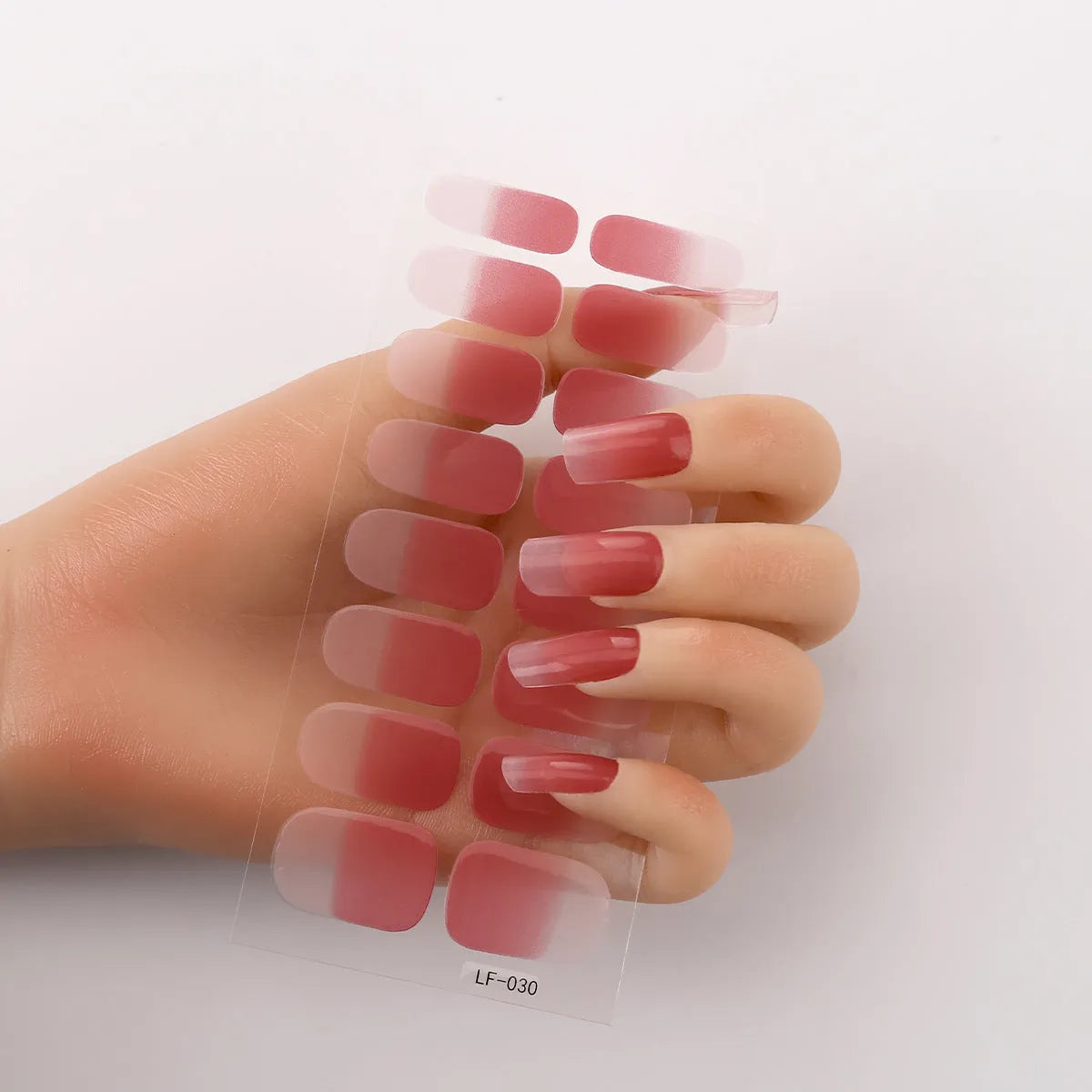 Set of 16 solid colour full nail art stickers showing patterns like cross, rose, tulip, and cartoon designs.