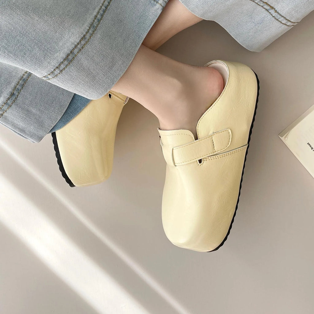 Women's flat buckle casual sneakers in yellow, creamy-white, silver, and black colours with round toe design