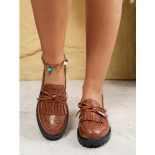 Women's brown loafers with decorative bow on artificial PU leather upper