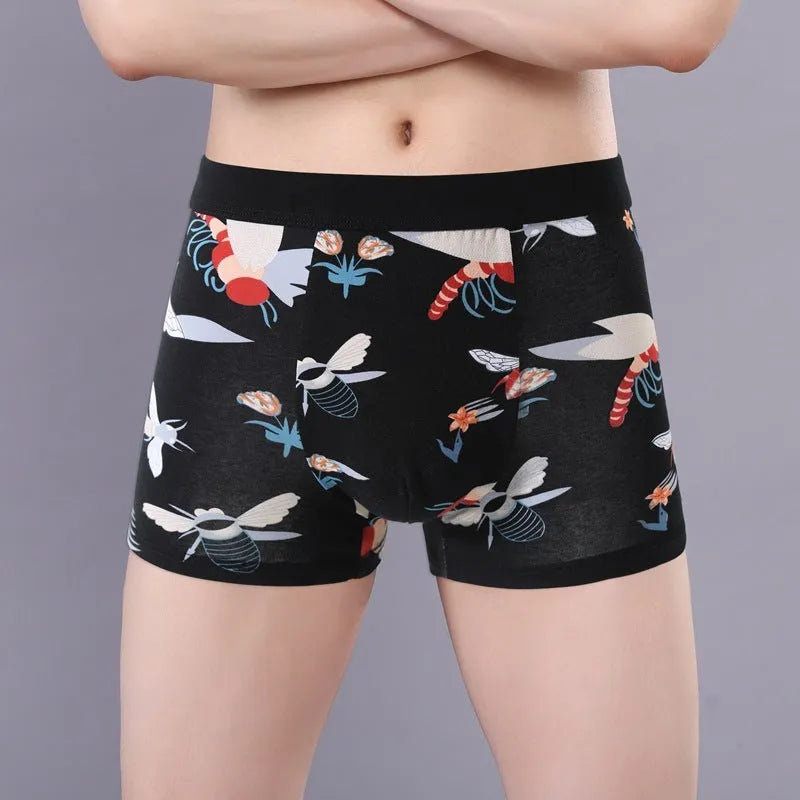 Men's floral print cotton boxer shorts showing mid-waist fit and U-shaped convex design.