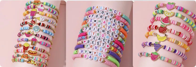 Children's polymer clay bracelet with dinosaur bead theme on a white background