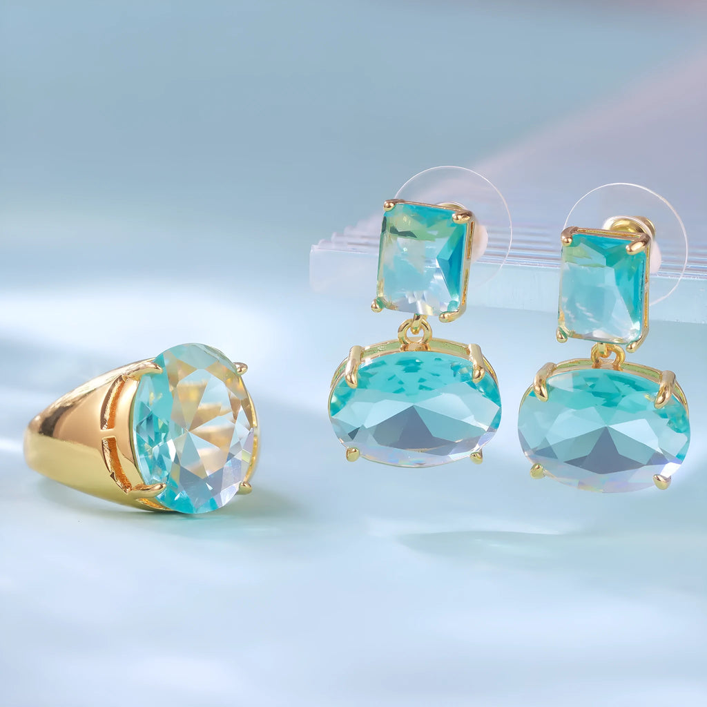 Crystal geometric ellipse earrings in golden blue with real gold plating and glass pendant on copper base