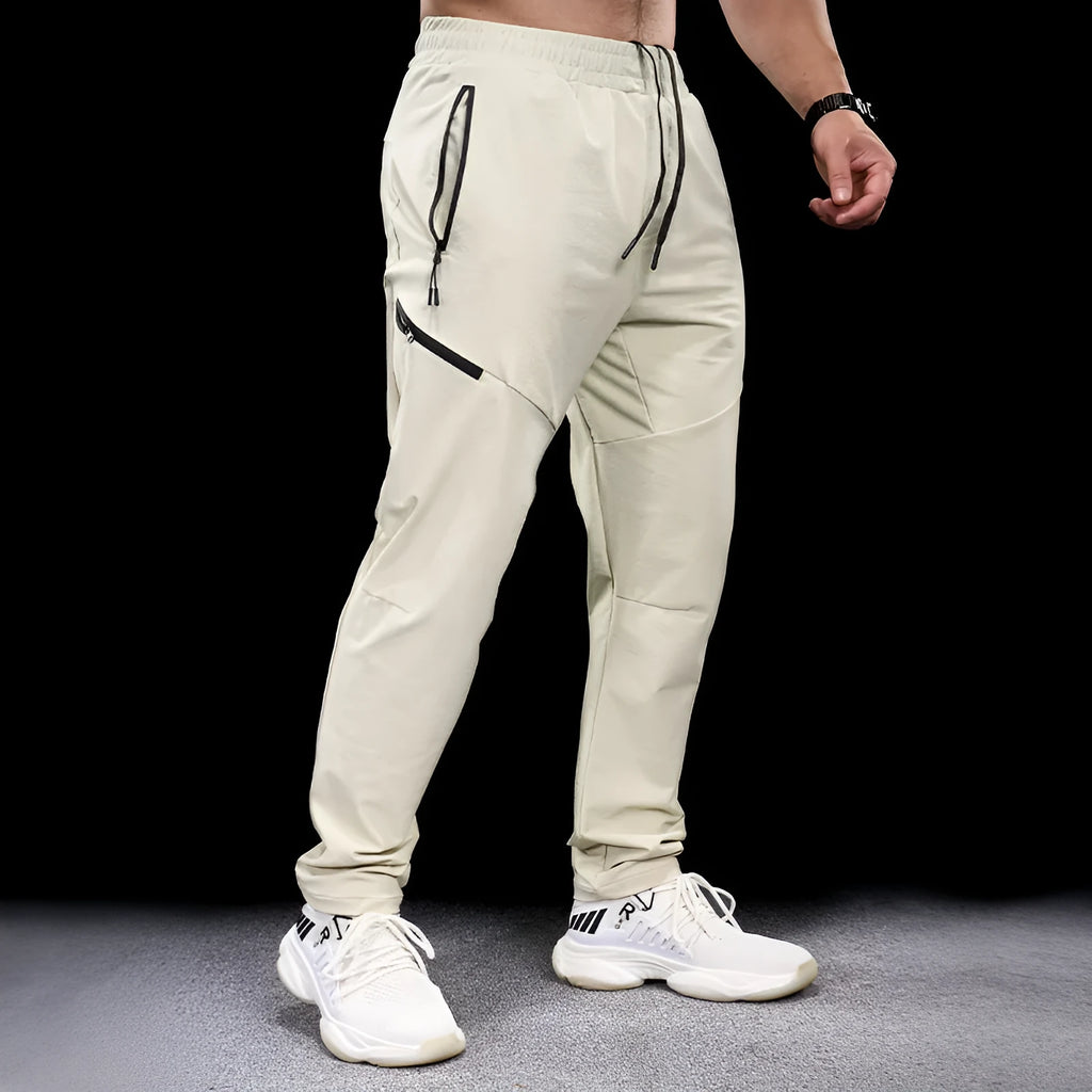 Men's waterproof workout pants in quick-drying nylon fabric for sports and fitness activities