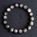 Natural obsidian crater ball bracelet with polished beads in silver or golden meteorite colours