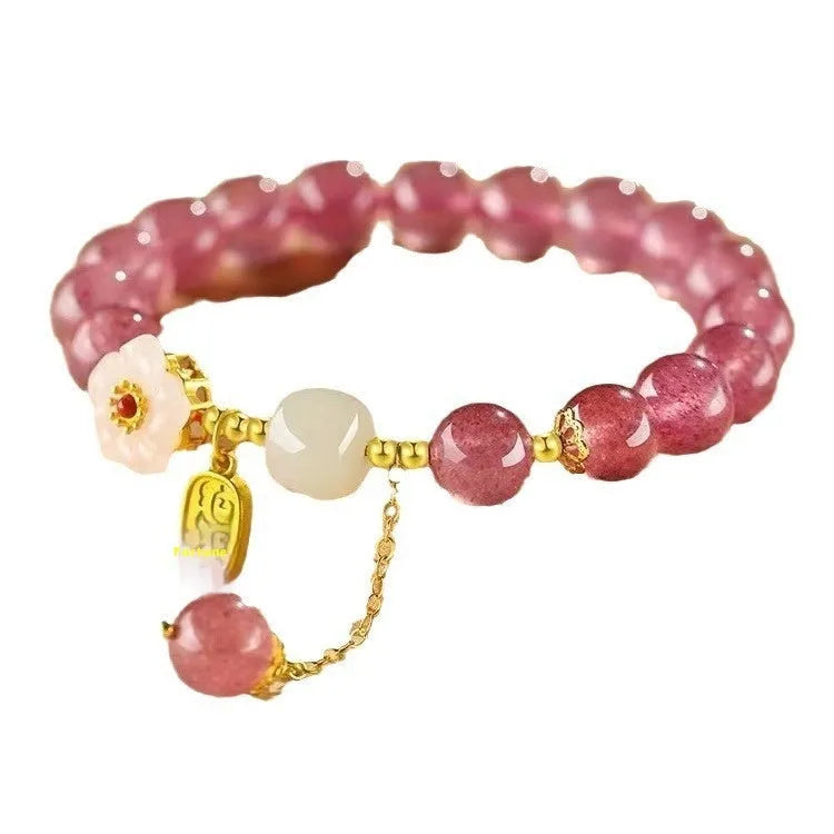 Handcrafted strawberry quartz crystal bracelet with Hetian jade peach blossom charms for women