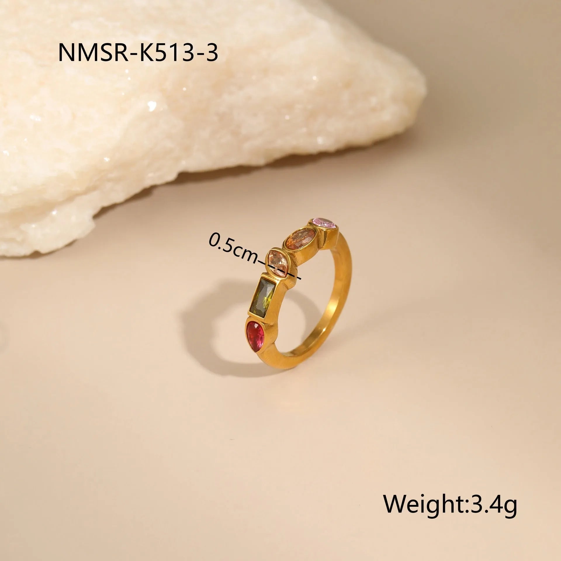 Geometric gold-plated jewellery set with necklace, earrings, and ring on display