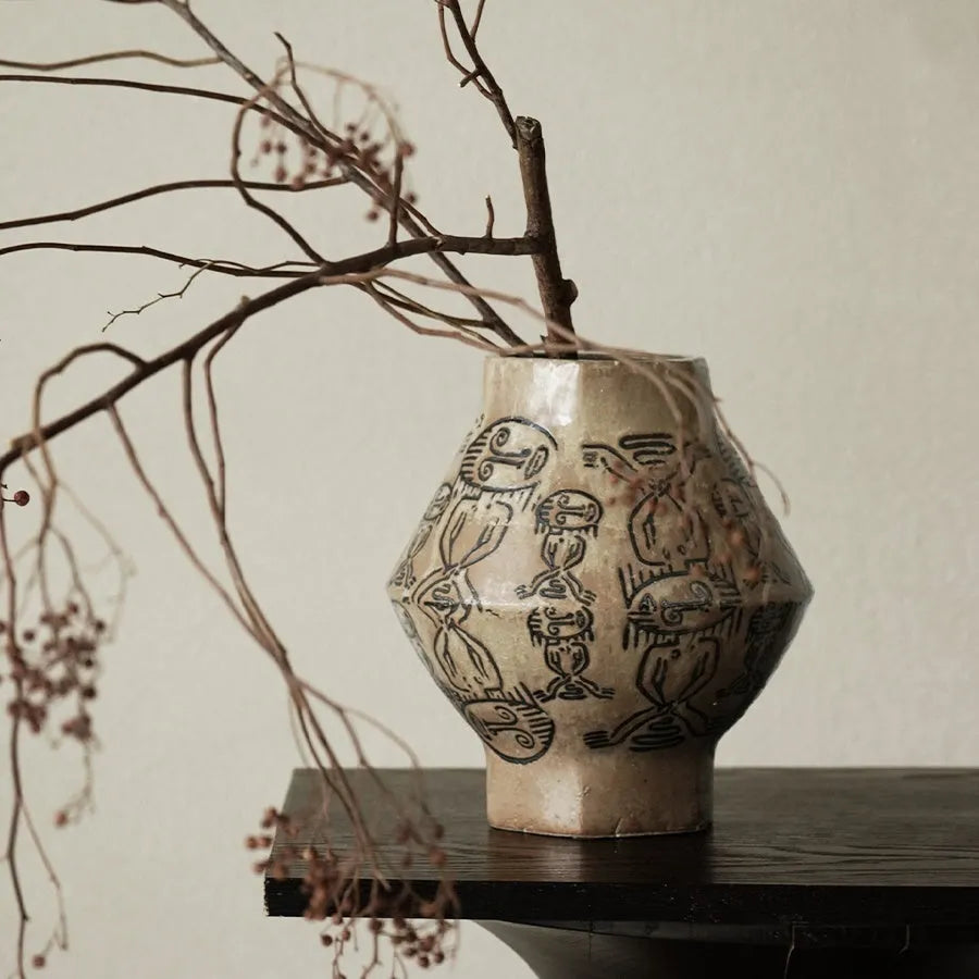 Hand-painted ceramic cylindrical vase with carved tribal totem vintage design.
