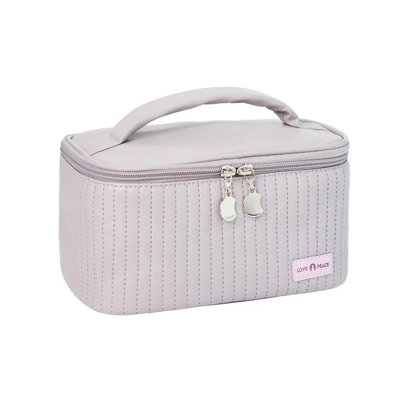 Open-top round cake-shaped makeup bag in a solid PU leather colour from the pink, coffee, beige, blue, green, purple range.