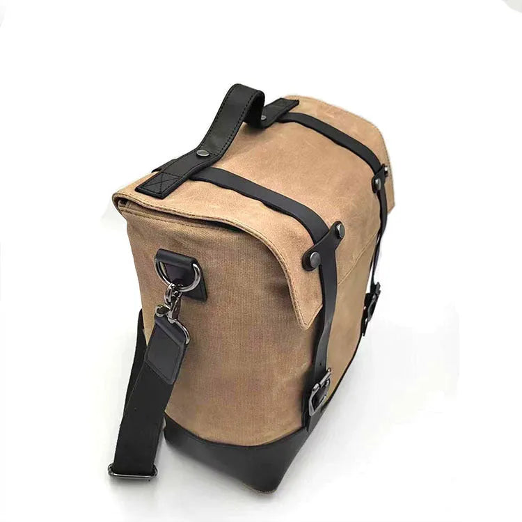 Waterproof canvas motorcycle side bag with cowhide reinforcement showing dimensions and colour options