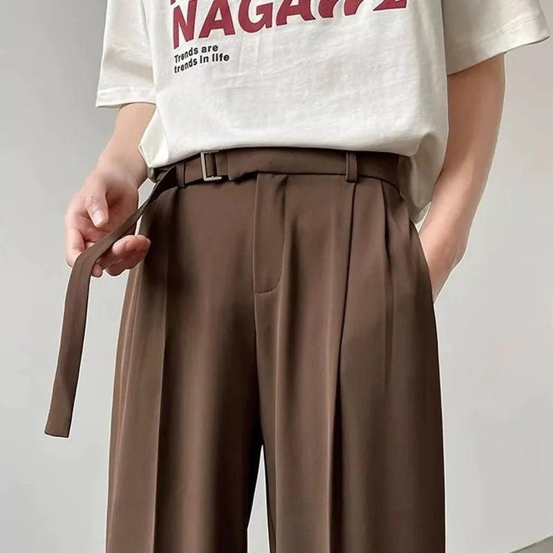 Black loose fit wide leg casual trousers with straight hem on a mannequin.