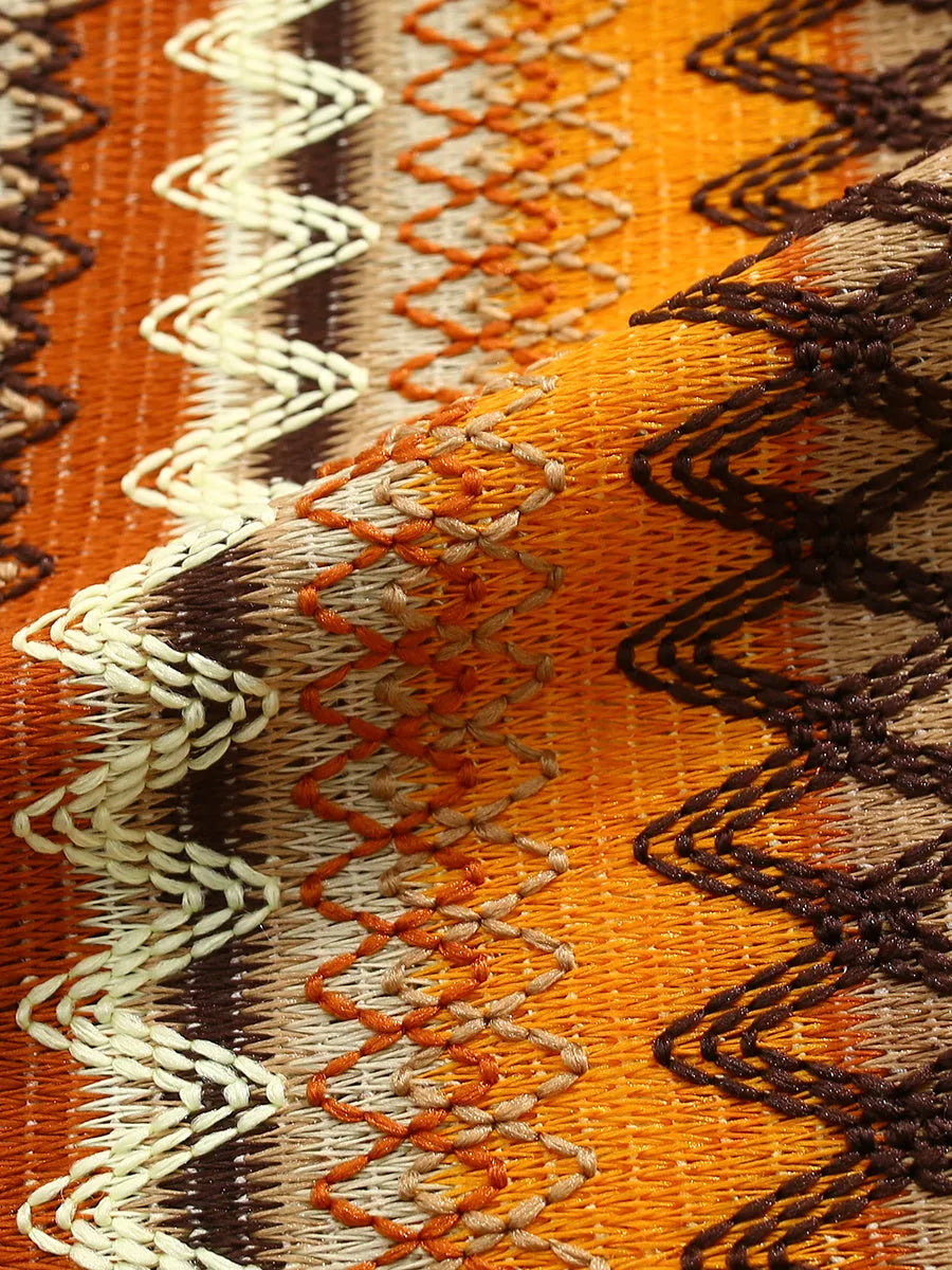 Ethnic style woven shirt with Cuban collar and contrast colours, shown in a loose fit with short sleeves.