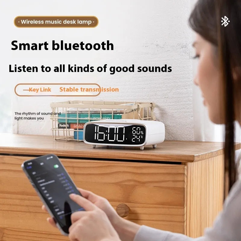 White Bluetooth speaker wireless charger with night lamp showing Qi charging surface and LED illumination
