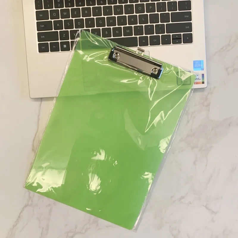 Transparent A4 clipboard with metal clip holding white paper, available in blue, green, red, and white.