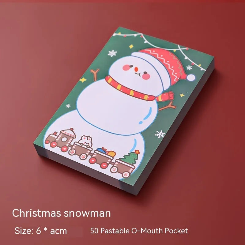 Christmas sticky notes pad with festive designs including elf, gift, sled, Santa Claus, bear, and snowman