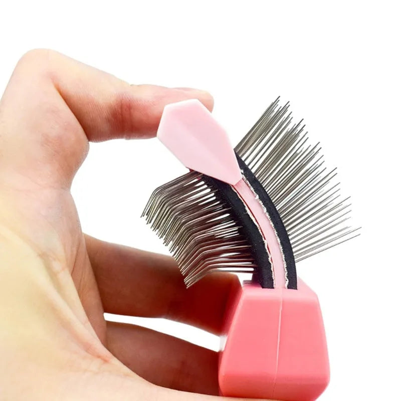 Blue double-sided pet brush with stainless steel pins and ergonomic handle on a white background