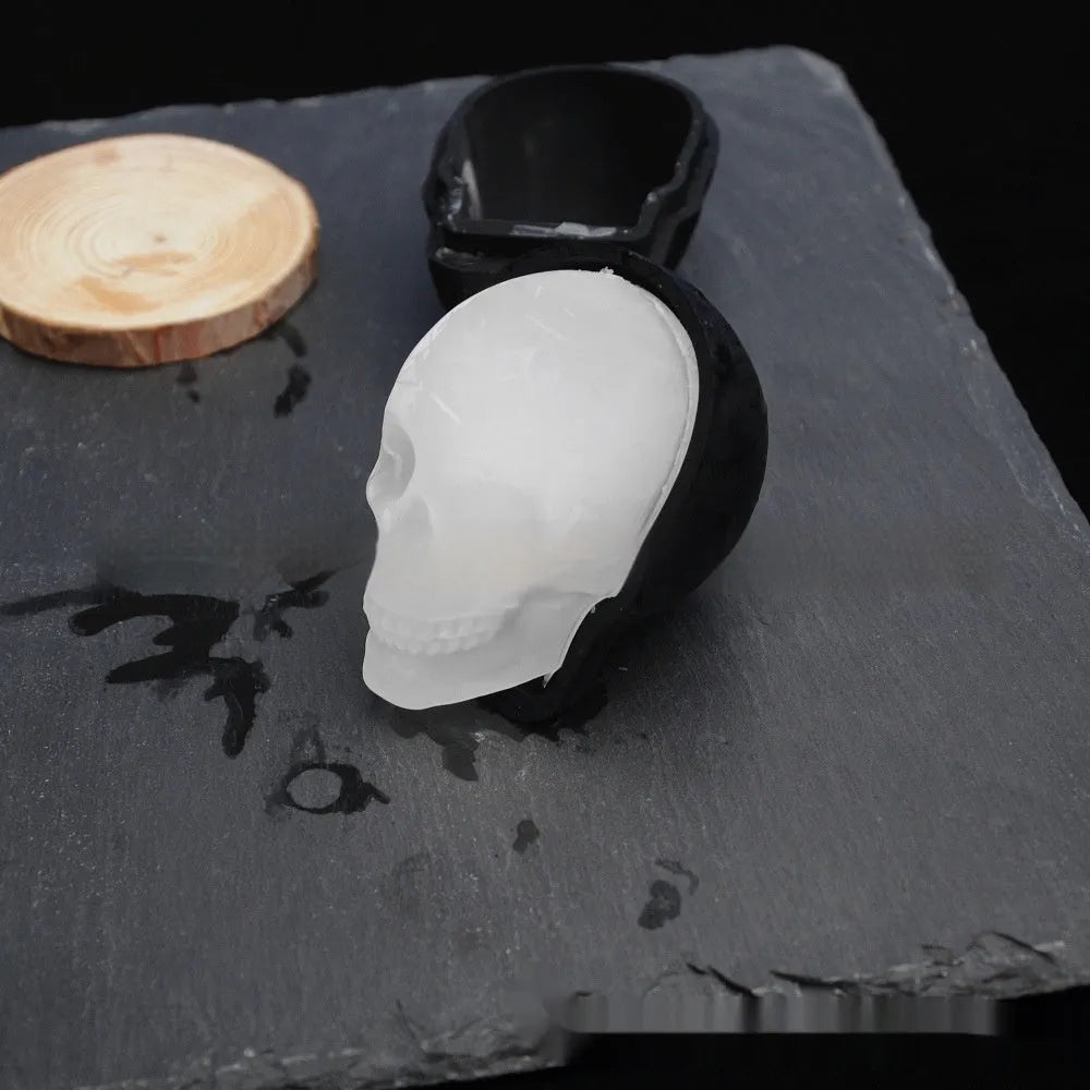 White silicone Halloween ice cube tray with detailed 3D skull mould cavities.