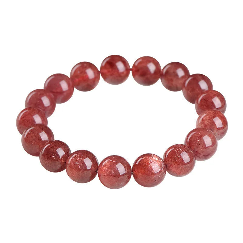 Natural red strawberry quartz crystal bracelet with geometric cut beads, shown in unisex styling.