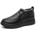 Men's black winter slip-on shoes with fleece lining and rubber sole on grey background