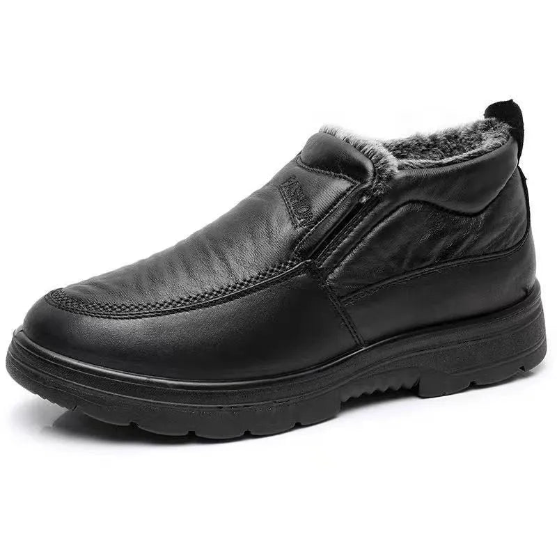 Men's black winter slip-on shoes with fleece lining and rubber sole on grey background