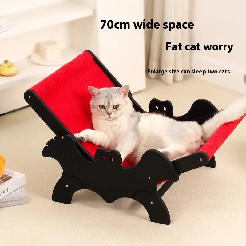 Wooden cat lounge chair with scratching posts and cage enclosure featuring a Halloween bat design in black and red.
