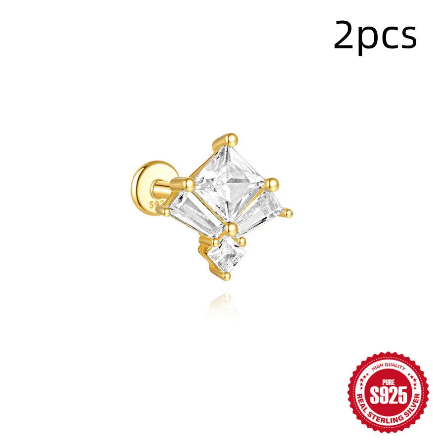Golden geometric S925 sterling silver stud earrings with zircon inlays, showing clover, crown, and chain horse eye designs.