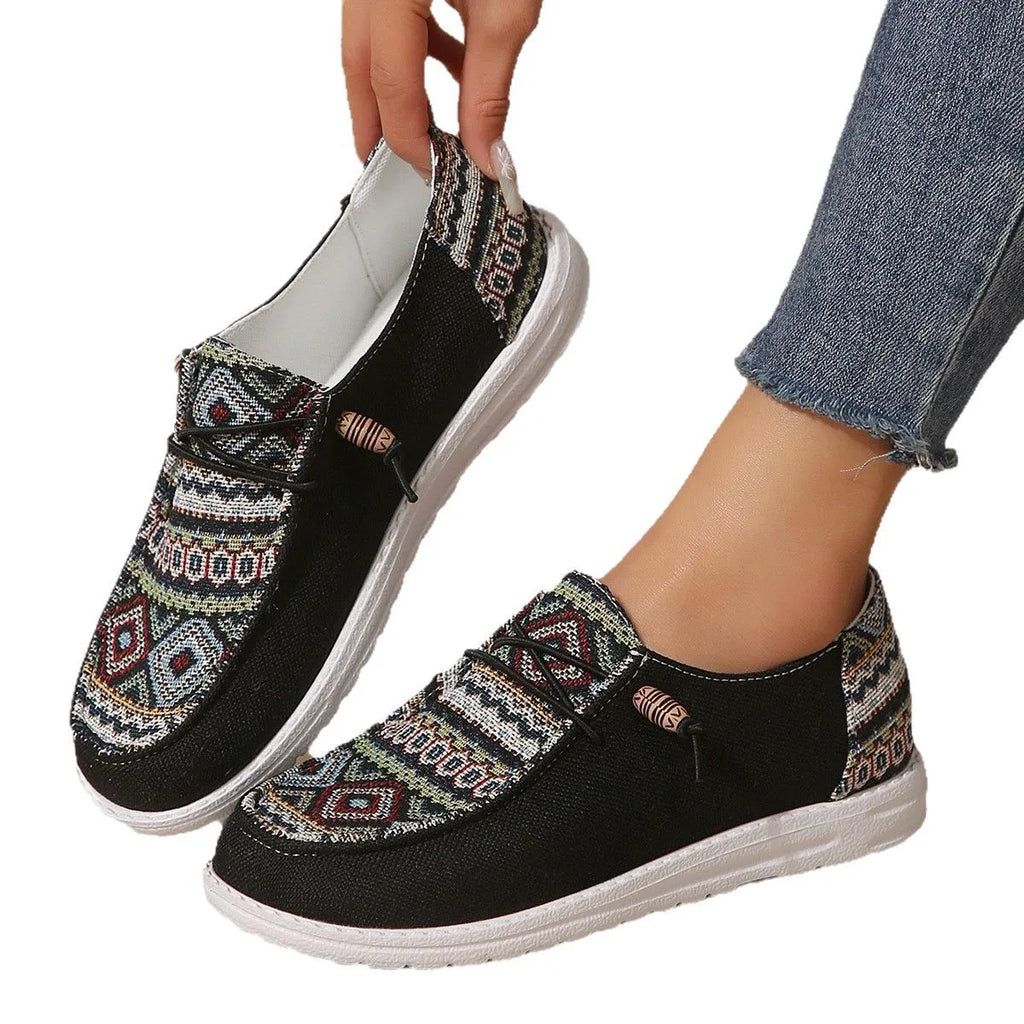 Women's flat round toe casual shoes in black, dark grey, or khaki with a low-top design and rubber sole.
