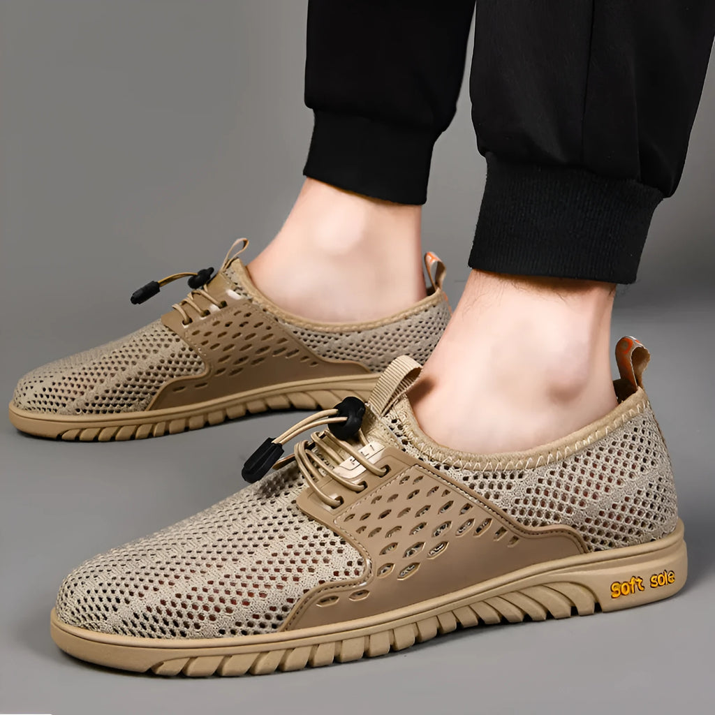 Men's black mesh casual sports shoes with elastic band and rubber sole.