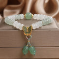 Green crystal women's bracelet with abacus beads, butterfly tassel, rhinestones and pearls