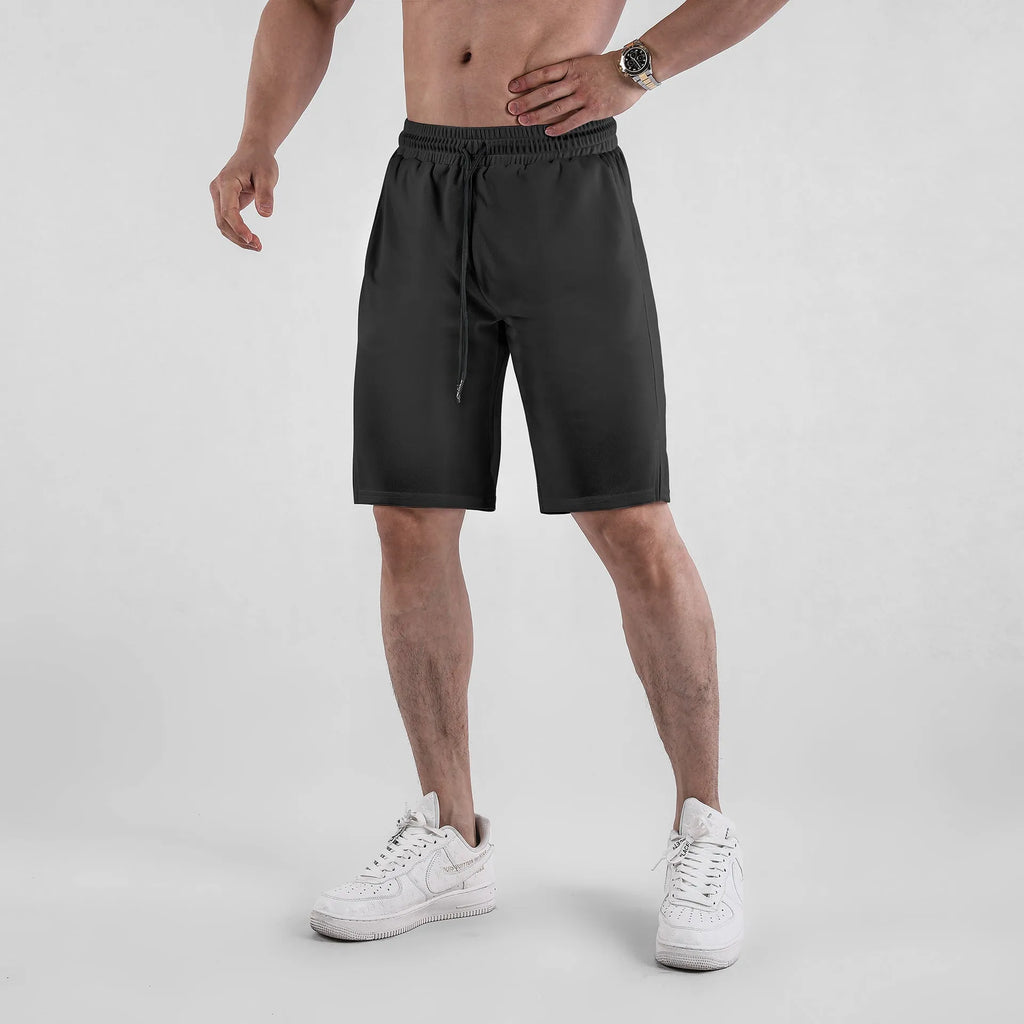 Men's black and white quick-dry mesh shorts with elastic waistband and loose fit