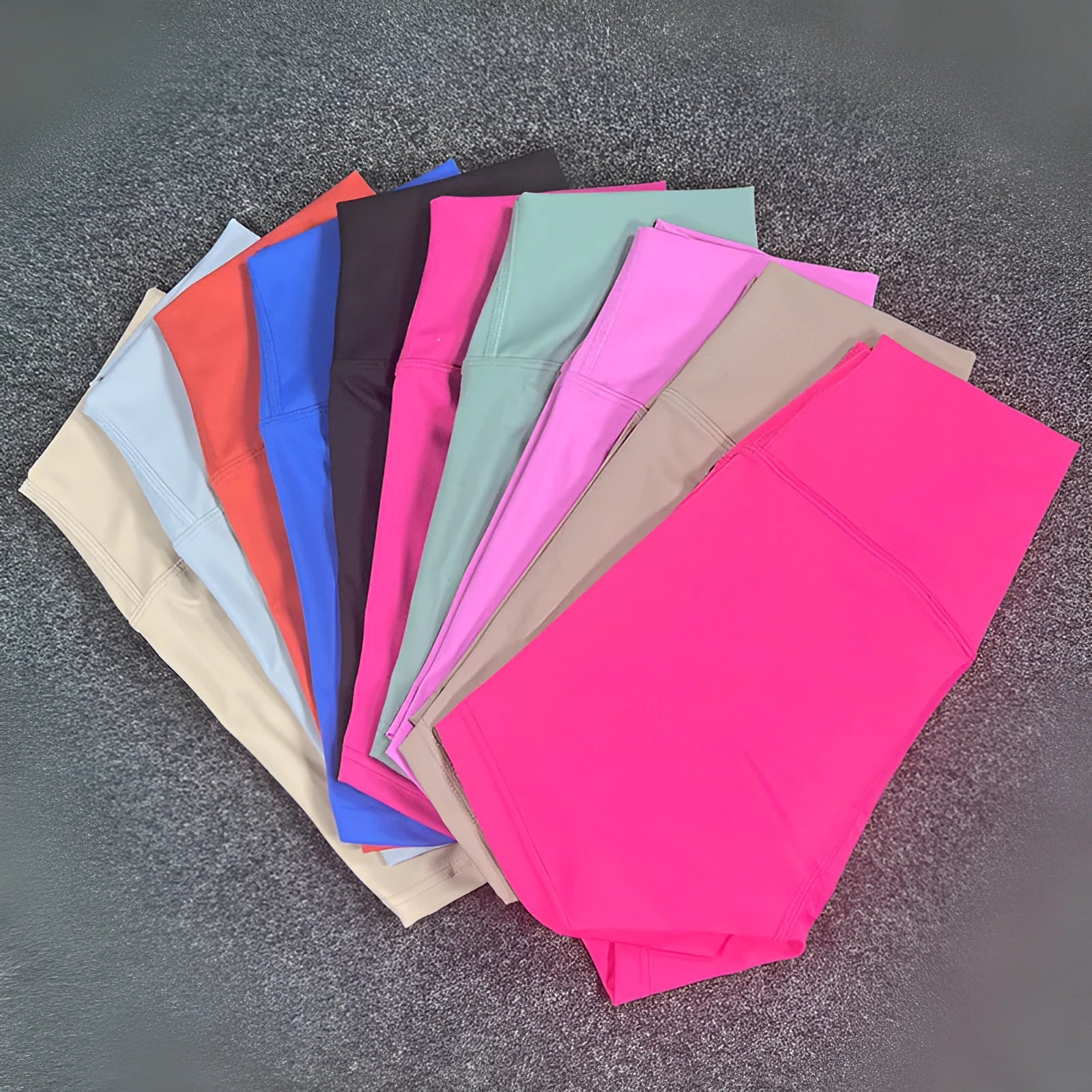 Women's high waist yoga shorts in nylon fabric, shown in pink litchi colour.