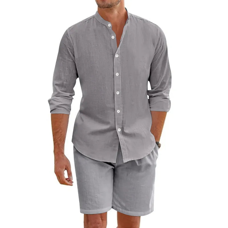 Men's dark grey linen blend short sleeve shirt and drawstring shorts set laid flat.