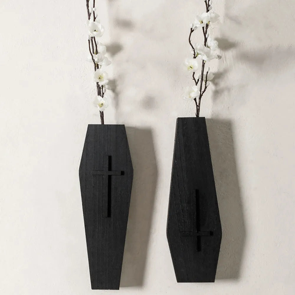 Wooden cross wall shelf decoration in black with integrated vase shelf measuring 27cm by 9cm