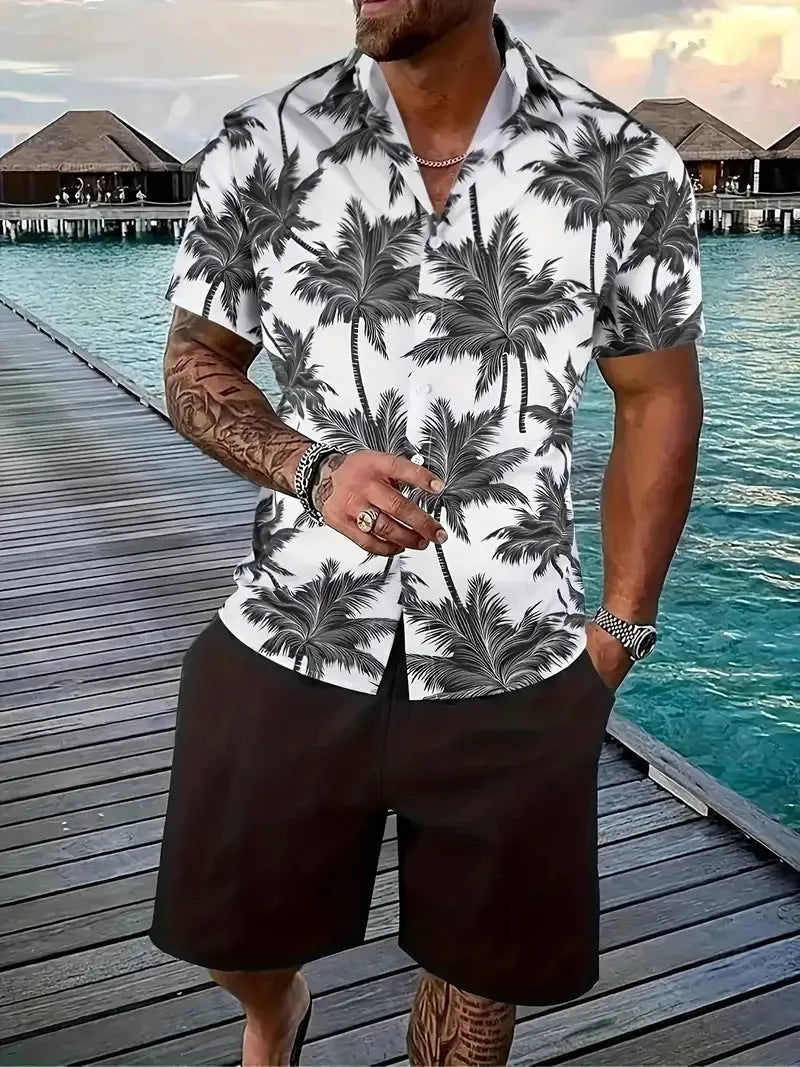 Man wearing a blue Hawaiian print short sleeve shirt and matching shorts from the casual suit set.