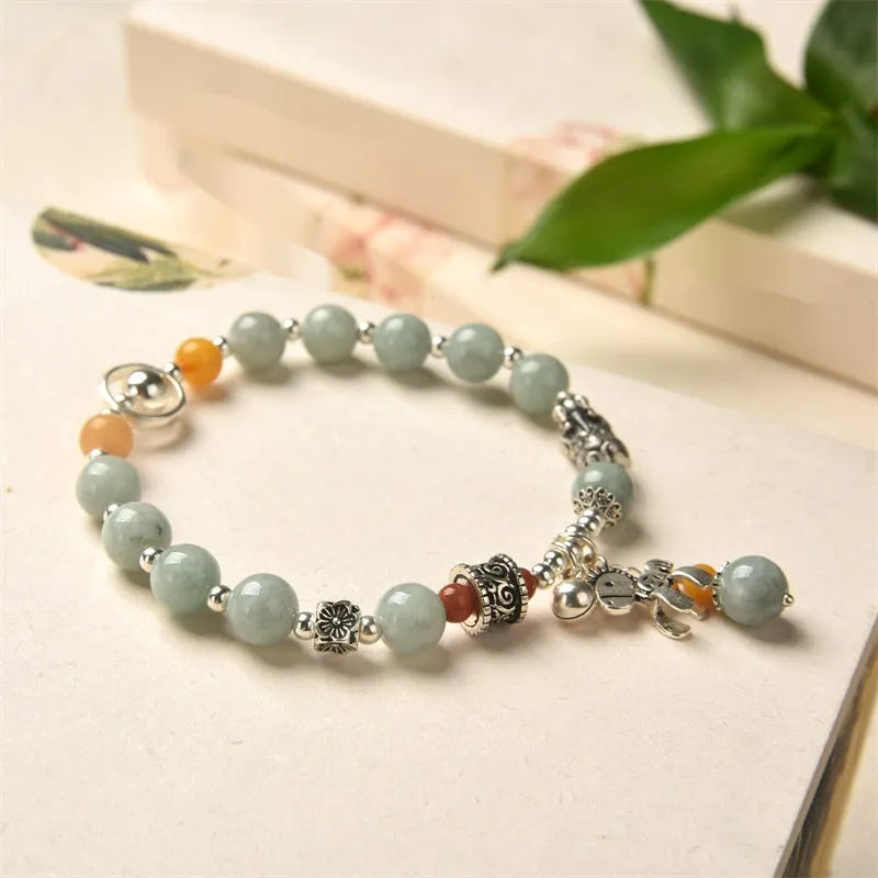 Natural emerald green jade vintage pony style bracelet with an alloy clasp.