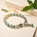 Natural emerald green jade vintage pony style bracelet with an alloy clasp.
