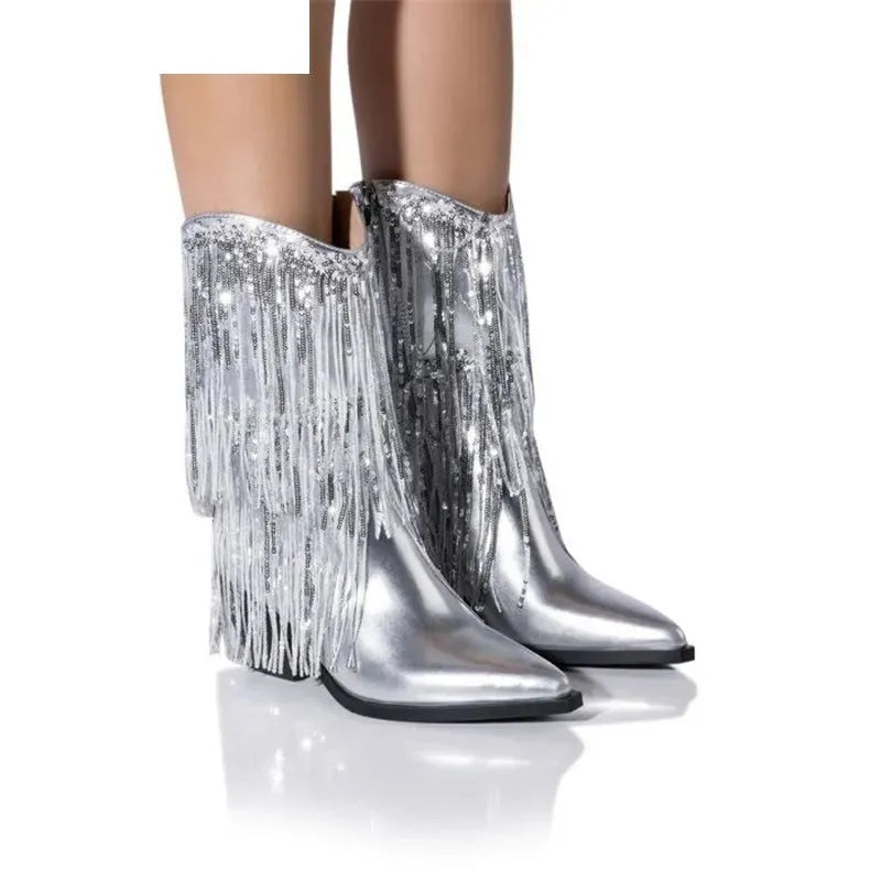 Women's black chunky heel tassel ankle boots with a pointed toe and stiletto heel on a white background.
