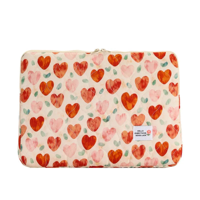 Floral print cloth laptop bag in green flower, pink floral, red flower, and red heart designs, showing three size options.