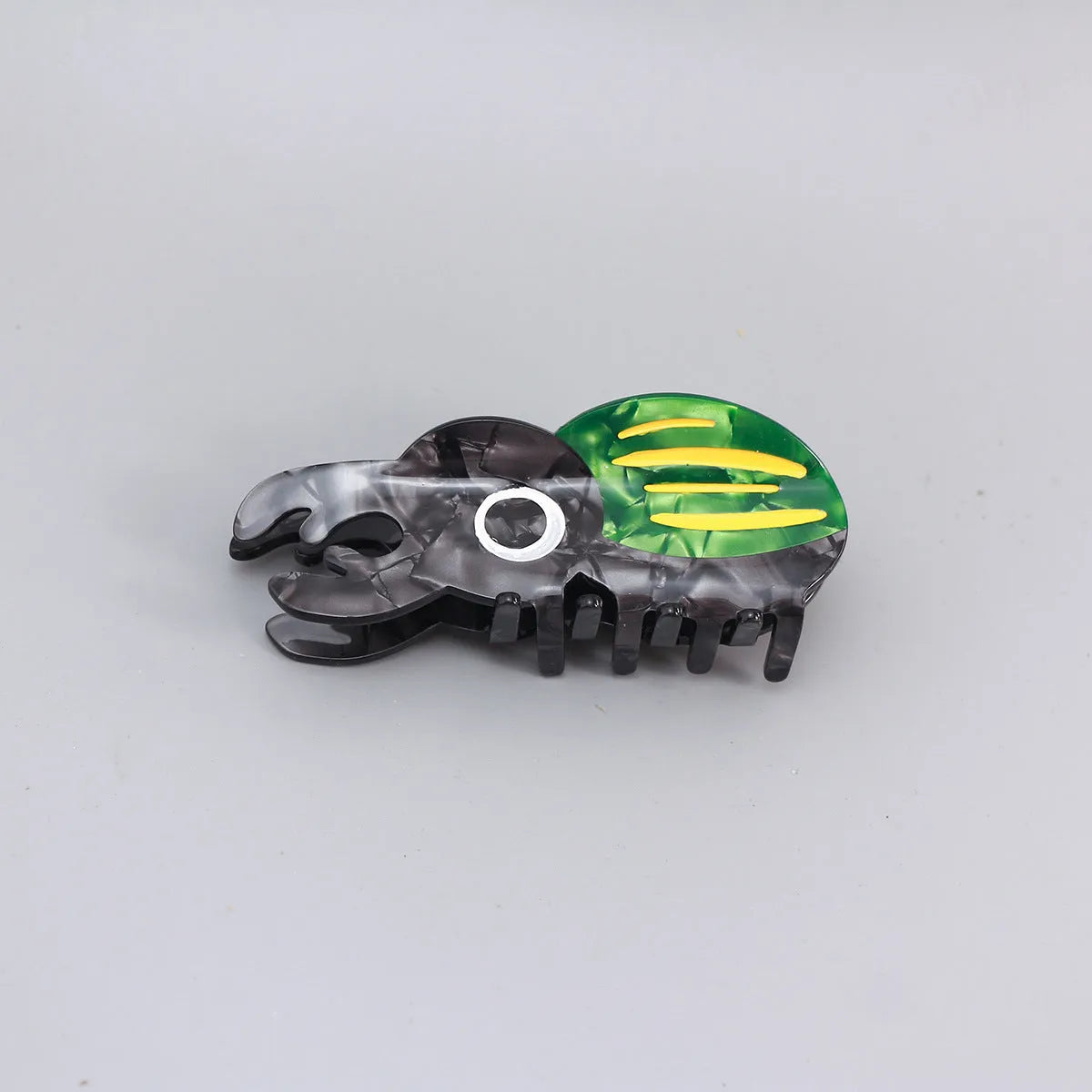 Handmade cellulose acetate insect beetle grip desk accessory with cartoon caterpillar design