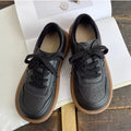 Round-toe cowhide leather lace-up flat shoes in black, soft rubber sole